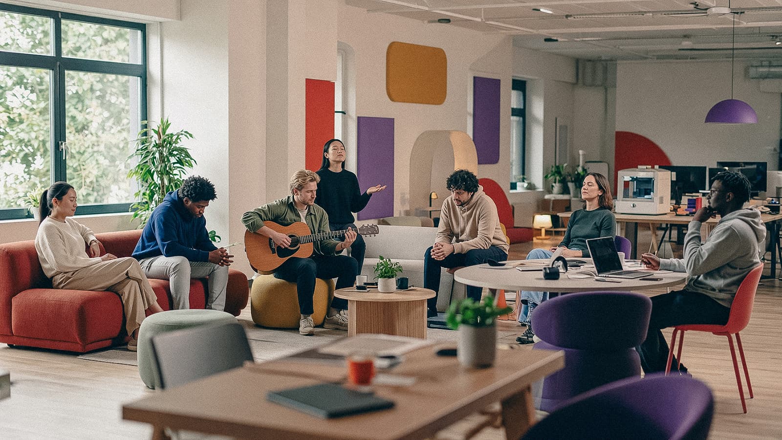 People gathering in a studio, making music and working together